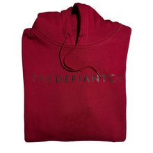Load image into Gallery viewer, A photo of a standard fit, unisex The Defiant Co Hoodie.  The hoodie has draw strings and a pouch pocket on the front as per all standard designs.  The hoodie has the famous The Defiant Co logo across the front of the chest and is plain on the back.  The colour is burgundy.