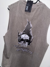 Load image into Gallery viewer, A photo showing the back of a unisex sleeveless t-shirt.  The shirt has a big bold print on the back of a skull in flames. Underneath the skull is the defiant tag line &#39;Proudly Refusing To Obey Authority&#39; with the The Defiant Co logo under that. The sleeveless is faded grey in colour.