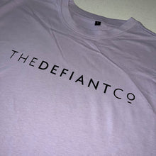 Load image into Gallery viewer, A photo showing an oversized The Defiant Co T-Shirt.  The shirt has the famous ‘The Defiant Co’ logo across the front of the chest.  The shirt has a round neck and is oversized.  This particular version is the colour lilac.