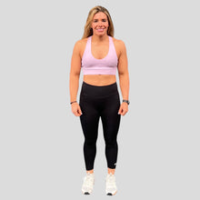 Load image into Gallery viewer, A photo showing the front of the amazing The Defiant Co Infinity Sports Bra.  The bra has a unique crossed back with The Defiant Co logo across both straps giving it a really standout look. The front is plain and simple giving it a really classy look. The colour is lilac.