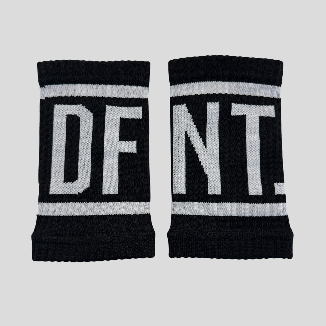 A photo collage showing the DFNT. performance sweat bands.  The sweat bands are black with DFNT. in white incased in a white border.  The sweatbands are elasticated and will stand up to any workout.