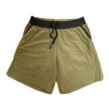 Load image into Gallery viewer, A photo of the best selling The Defiant Co Performance Shorts.  The shorts have a black elasticated waistband with draw strings and have The Defiant Co logo down the left leg.  The shorts have two pockets, one either side and are the colour olive green.