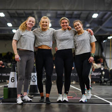 Load image into Gallery viewer, A photo showing a group of girls wearing the amazing, cropped acid wash t-shirts in light grey.  The shirt has the famous ‘The Defiant Co’ logo across the front of the chest.  The acid Wash effect of the shirt means no two are alike and provides the perfect blend of fashion and defiance.