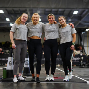 A photo showing a group of girls wearing the amazing, cropped acid wash t-shirts in light grey.  The shirt has the famous ‘The Defiant Co’ logo across the front of the chest.  The acid Wash effect of the shirt means no two are alike and provides the perfect blend of fashion and defiance.