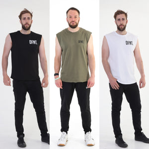 A photo collage showing the front design of the three variations of The Defiant Never Die sleeveless tee.  The colour options are black, olive green and white.  The tees are slightly oversized and have a round neckline.  The back design has the bold skull and lightening design with The Defiant Never Die slogan across the top and The Defiant Co along the bottom along with the date Defiant was formed.  The front has the DFNT. Logo to the left breast.