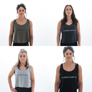A photo collage showing the four variations of the oversized women's tank top.  The tank top is floaty and slightly cropped and comes in olive green, black, charcoal and heather grey.  The Defiant Co logo is proudly displayed across the chest.