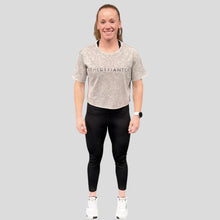 Load image into Gallery viewer, A photo showing a female fit, slightly oversized, cropped acid wash t-shirt. The shirt has the famous ‘The Defiant Co’ logo across the front of the chest.  The acid Wash effect of the shirt means no two are alike and provides the perfect blend of fashion and defiance. The shirt is light grey in colour with a slightly black wash.