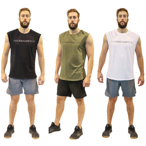 A photo collage showing the three iterations of The Defiant Co sleeveless t-shirt, the options are black, olive green and white.  The have the famous The Defiant Co logo printed across the centre of the chest, this white on the black tee and black on the olive green and white tees.  The tees are slightly oversized and have a round neck.