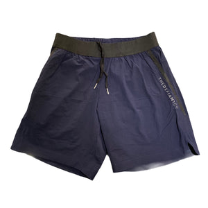 A photo of the best selling The Defiant Co Performance Shorts.  The shorts have a black elasticated waistband with draw strings and have The Defiant Co logo down the left leg.  The shorts have two pockets, one either side and are the colour navy blue.
